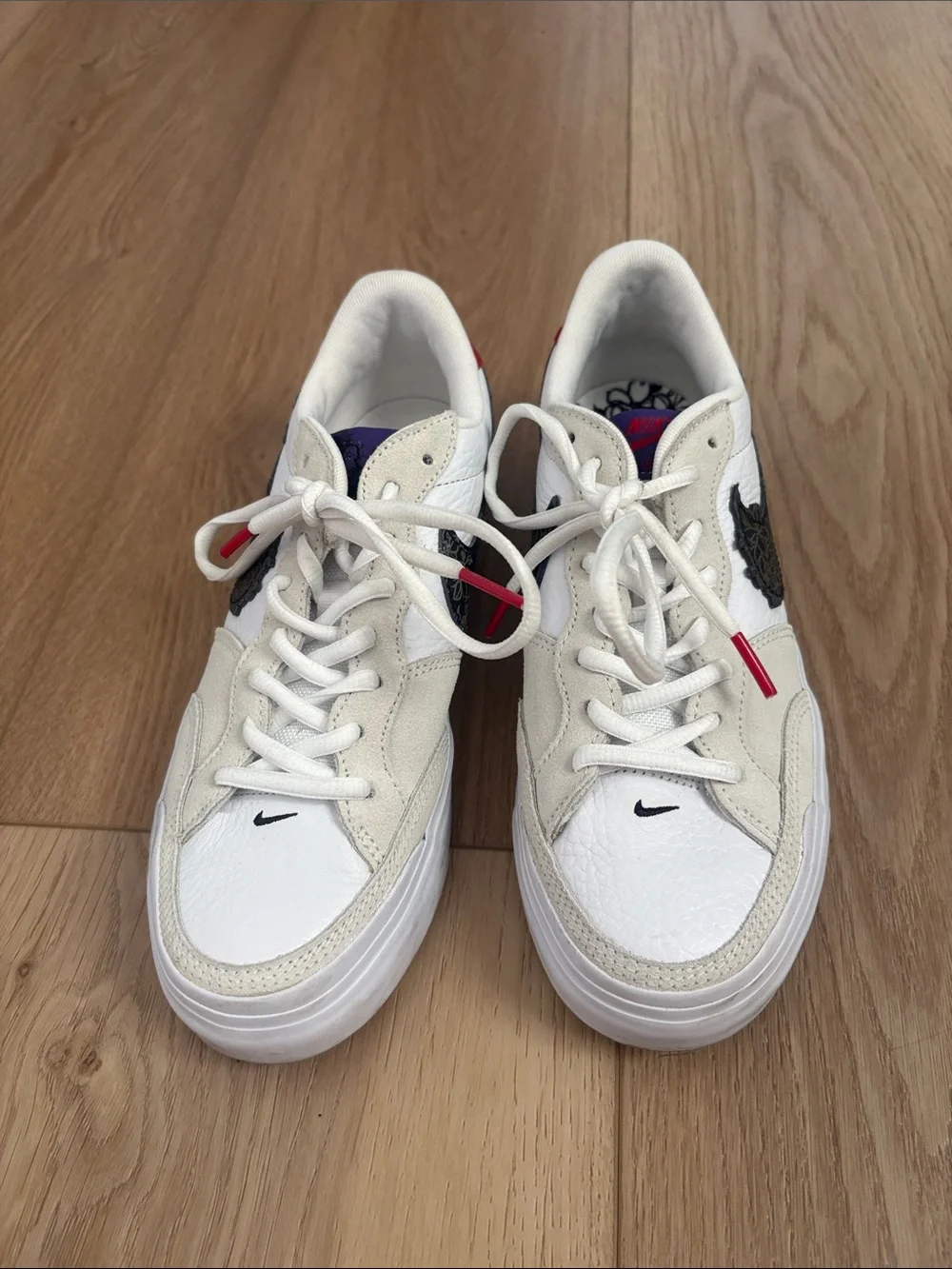 Nike Women’s White and Black Low-Top Sneakers with Red Accent
